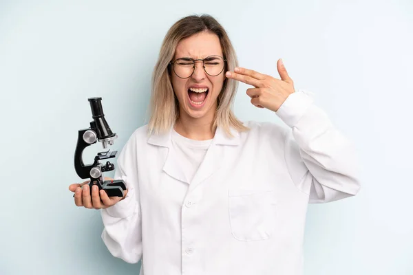 Blonde Woman Looking Unhappy Stressed Suicide Gesture Making Gun Sign — Stok fotoğraf