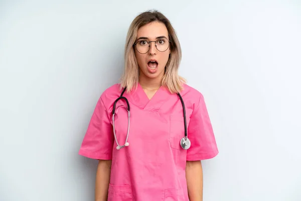 Blonde Woman Looking Very Shocked Surprised Nurse Concept — Fotografia de Stock