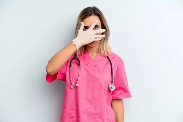 Blonde Woman Looking Shocked Scared Terrified Covering Face Hand Nurse — ストック写真