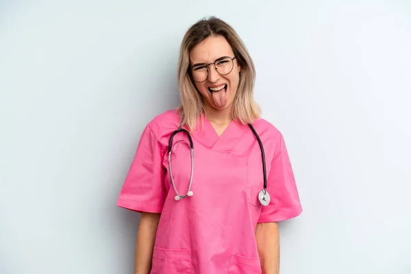 Blonde Woman Cheerful Rebellious Attitude Joking Sticking Tongue Out Nurse — Stockfoto