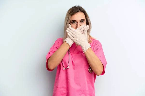 Blonde Woman Covering Mouth Hands Shocked Nurse Concept — Stockfoto