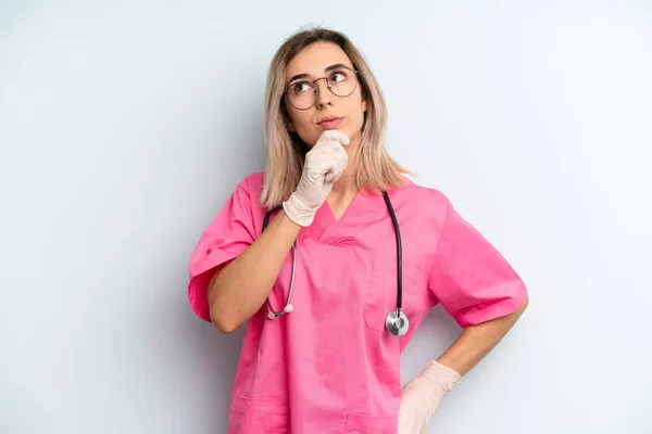 Blonde Woman Thinking Feeling Doubtful Confused Nurse Concept — Zdjęcie stockowe