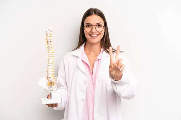 Pretty Woman Smiling Looking Happy Gesturing Victory Peace Spine Specialist — Stockfoto