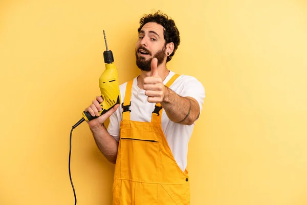 Young Man Feeling Proud Smiling Positively Thumbs Handyman Drill — Stock Photo, Image