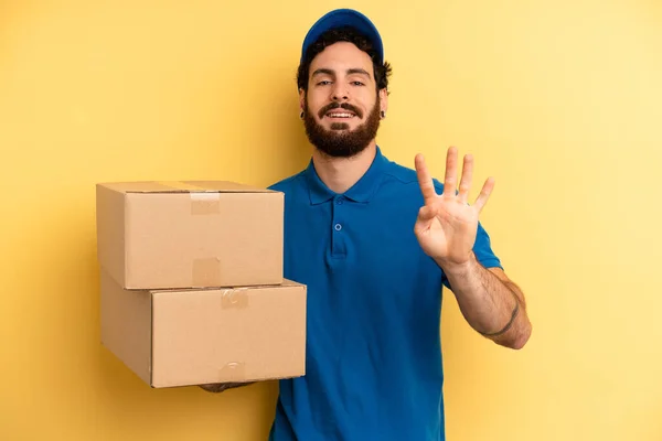 Young Man Smiling Looking Friendly Showing Number Four Company Employee — Stock Photo, Image