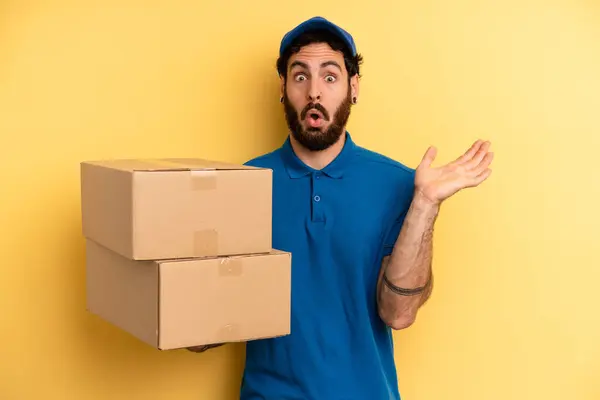 Young Man Looking Surprised Shocked Jaw Dropped Holding Object Company — Stock Photo, Image