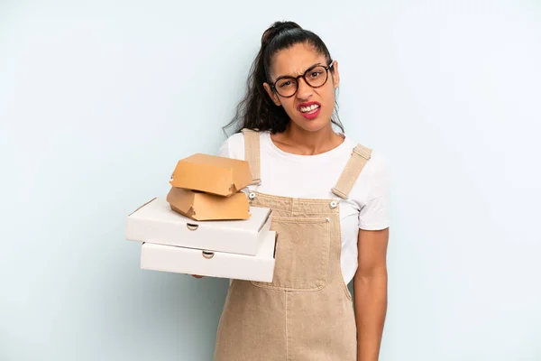 Hispanic Woman Feeling Puzzled Confused Fast Food Take Away Concept — Stockfoto