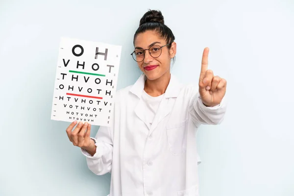 Hispanic Woman Smiling Looking Friendly Showing Number One Optical Vision — Fotografia de Stock