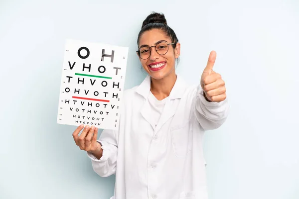 Hispanic Woman Feeling Proud Smiling Positively Thumbs Optical Vision Test — Fotografia de Stock