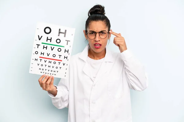 Hispanic Woman Feeling Confused Puzzled Showing You Insane Optical Vision — Stockfoto