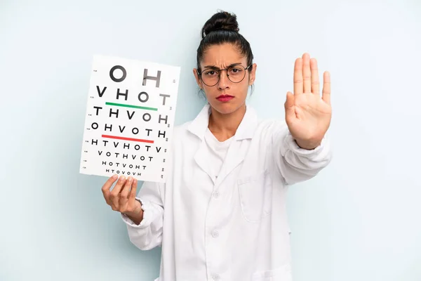 Hispanic Woman Looking Serious Showing Open Palm Making Stop Gesture — Stok fotoğraf