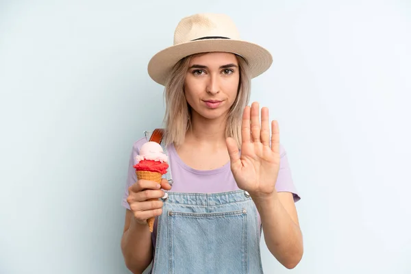 Blonde Woman Looking Serious Showing Open Palm Making Stop Gesture — 스톡 사진