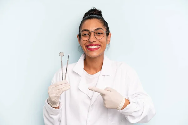Hispanic Woman Smiling Cheerfully Feeling Happy Pointing Side Dentist Concept — Stock Photo, Image