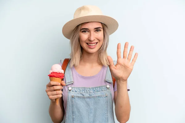 Blonde Woman Smiling Looking Friendly Showing Number Five Ice Cream — Fotografia de Stock