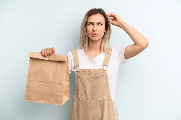 Blonde Woman Feeling Puzzled Confused Scratching Head Take Away Delivery — ストック写真