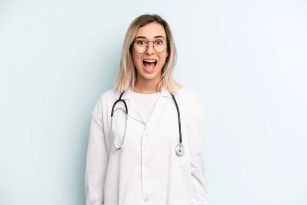 Blonde Woman Looking Happy Pleasantly Surprised Medicine Student Concept — Stockfoto