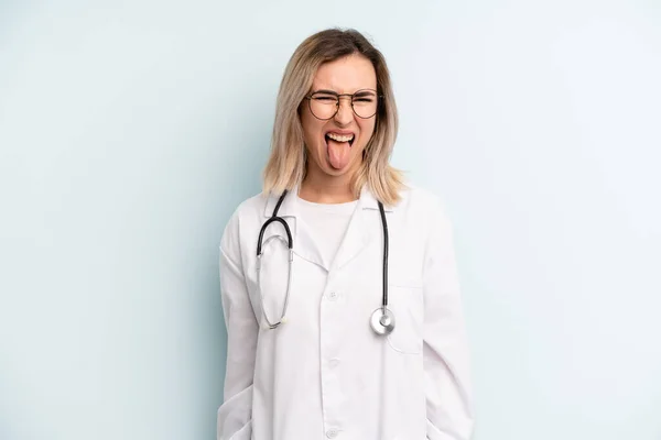 Blonde Woman Cheerful Rebellious Attitude Joking Sticking Tongue Out Medicine — Zdjęcie stockowe