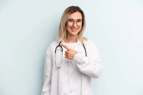 Blonde Woman Looking Excited Surprised Pointing Side Medicine Student Concept — Stockfoto