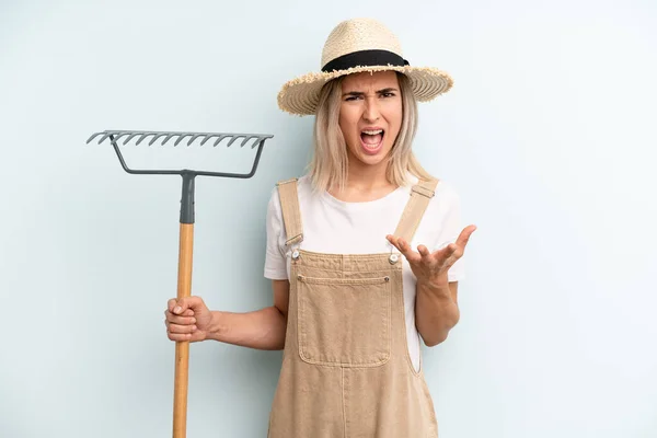 Blonde Woman Looking Angry Annoyed Frustrated Farmer Rake Cocnept — Foto Stock