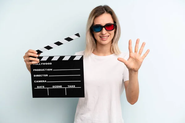 Blonde Woman Smiling Looking Friendly Showing Number Five Film Movie — Stockfoto