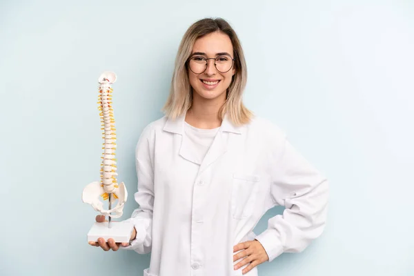 Blonde Woman Smiling Happily Hand Hip Confident Medicine Student Concept — Stockfoto