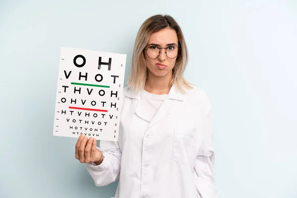 Blonde Woman Looking Puzzled Confused Optical Vision Test Concept —  Fotos de Stock