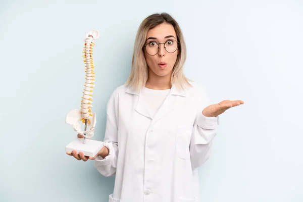 Blonde Woman Looking Surprised Shocked Jaw Dropped Holding Object Medicine — Stockfoto