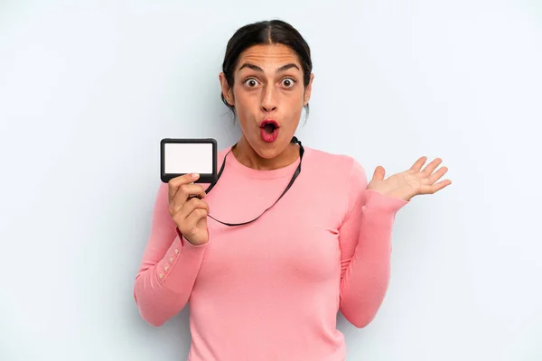 Hispanic Woman Looking Surprised Shocked Jaw Dropped Holding Object Vip — Stock Fotó