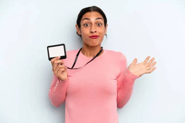 Hispanic Woman Feeling Puzzled Confused Doubting Vip Pass Card — Stock fotografie