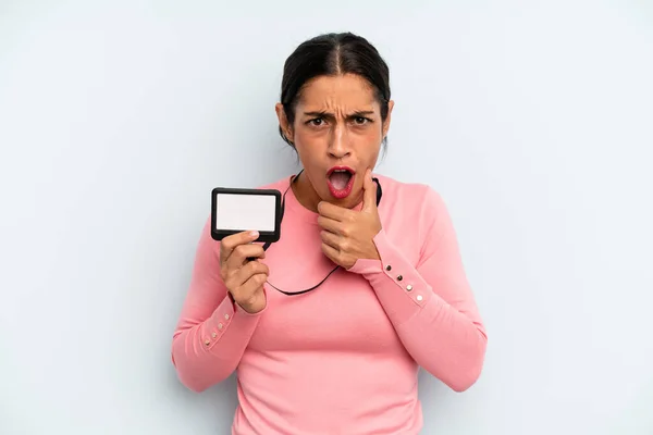 Hispanic Woman Mouth Eyes Wide Open Hand Chin Vip Pass — Stock fotografie
