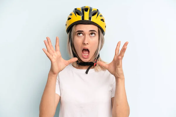 Blonde Woman Screaming Hands Air Bike Sport Concept — Stockfoto