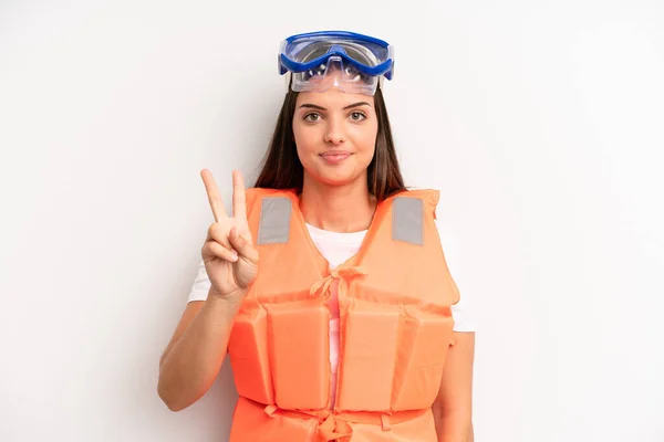 Pretty Girl Smiling Looking Friendly Showing Number Two Life Jacket — Stock Photo, Image