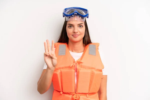 Pretty Girl Smiling Looking Friendly Showing Number Three Life Jacket — Stock Photo, Image