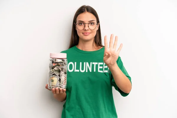 Pretty Woman Smiling Looking Friendly Showing Number Four Volunteer Donation — Fotografia de Stock