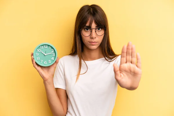 Hispanic Woman Looking Serious Showing Open Palm Making Stop Gesture — Stockfoto