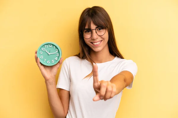 Hispanic Woman Smiling Proudly Confidently Making Number One Alarm Clock — Foto Stock