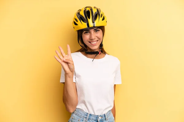 Pretty Woman Smiling Looking Friendly Showing Number Four Bike Sport — Zdjęcie stockowe