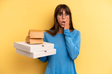 pretty woman feeling shocked and scared. take away fast food concept