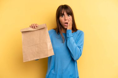 pretty woman feeling shocked and scared. take away fast food concept