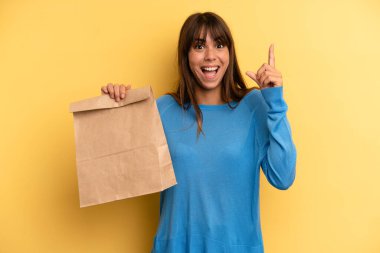 pretty woman feeling like a happy and excited genius after realizing an idea. take away fast food concept