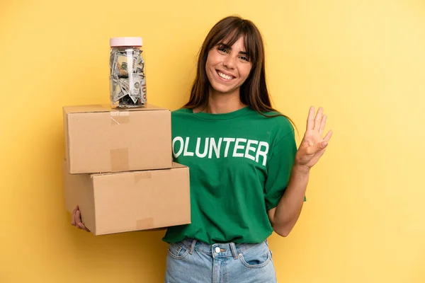 Pretty Woman Smiling Looking Friendly Showing Number Four Volunteer Donation — Stockfoto