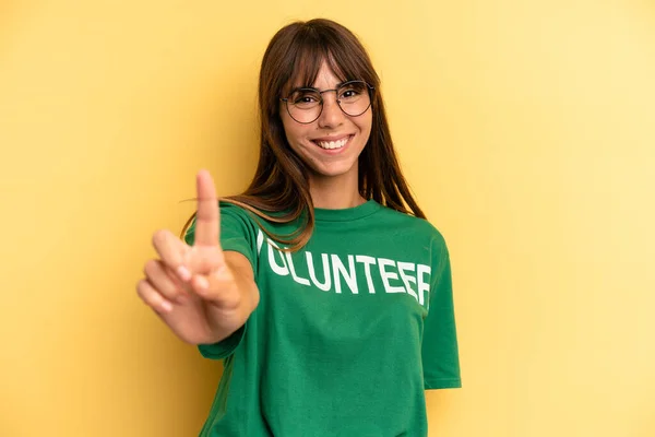 Pretty Woman Smiling Proudly Confidently Making Number One Volunteer Donation — Stock Photo, Image