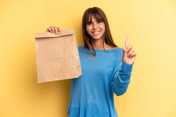 Pretty Woman Smiling Looking Friendly Showing Number One Take Away —  Fotos de Stock