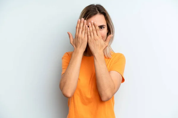 Young Adult Pretty Woman Covering Face Hands Peeking Fingers Surprised — Stockfoto