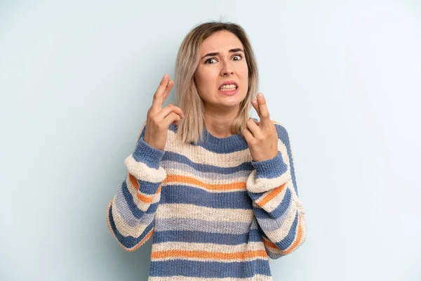 Young Adult Pretty Woman Crossing Fingers Anxiously Hoping Good Luck — Foto de Stock