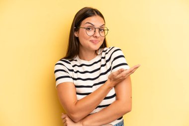 young adult pretty woman feeling confused and clueless, wondering about a doubtful explanation or thought