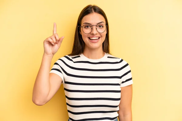 Young Adult Pretty Woman Smiling Cheerfully Happily Pointing Upwards One — Stockfoto
