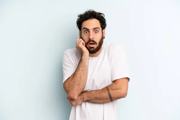 Young Adult Bearded Man Open Mouthed Shock Disbelief Hand Cheek — Stock Photo, Image