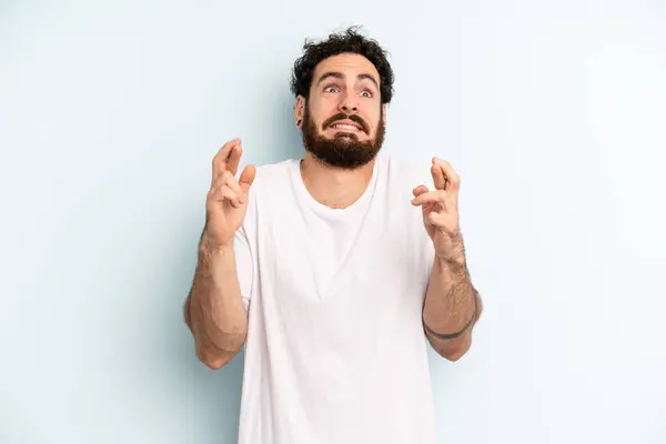 Young Adult Bearded Man Crossing Fingers Anxiously Hoping Good Luck — Stock Photo, Image