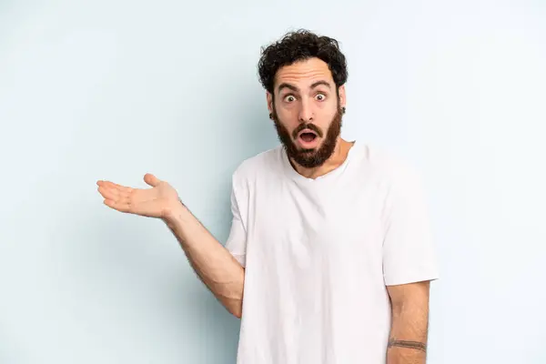 Young Adult Bearded Man Looking Surprised Shocked Jaw Dropped Holding — Stock Photo, Image